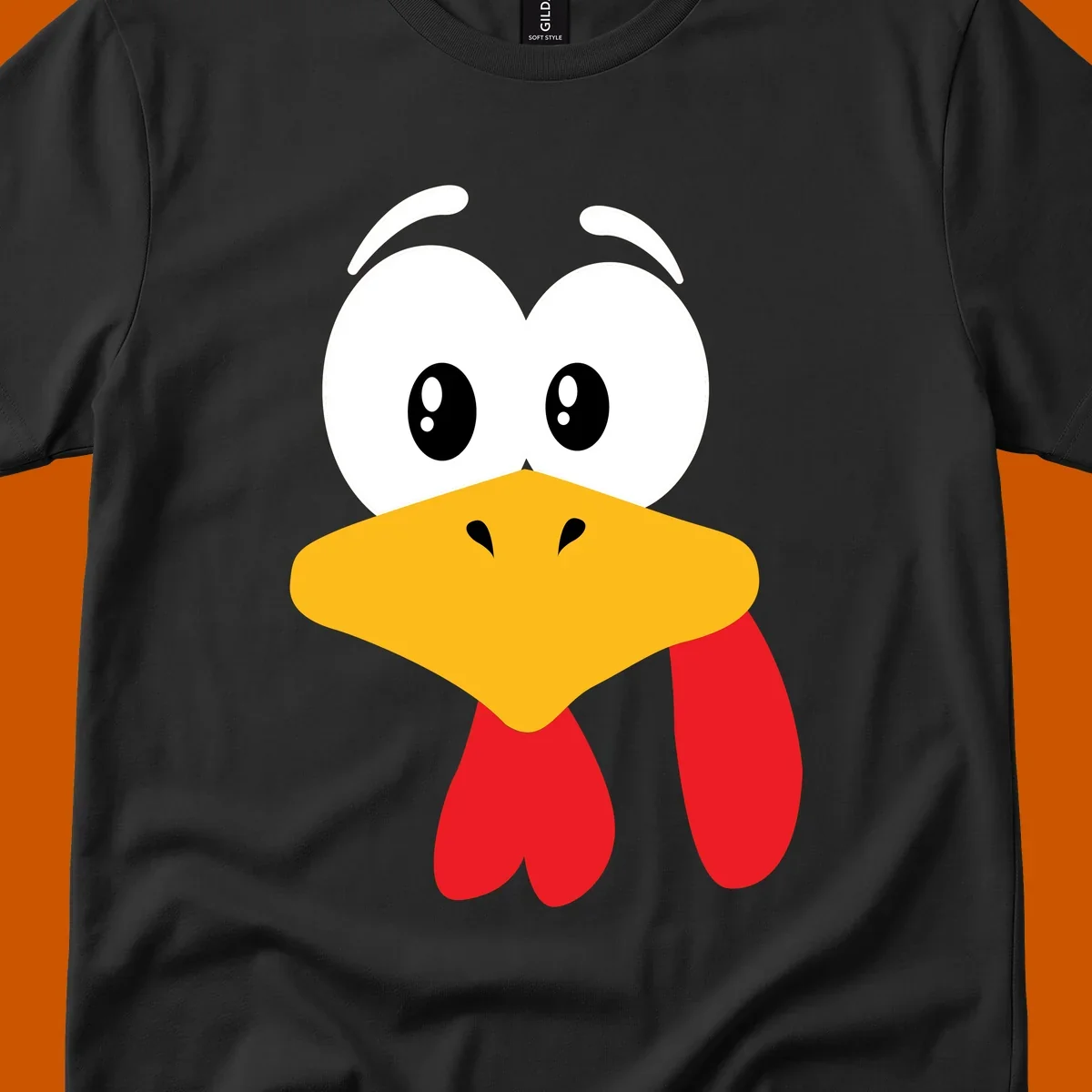 Funny cartoon turkey face graphic with googly eyes and a yellow beak.