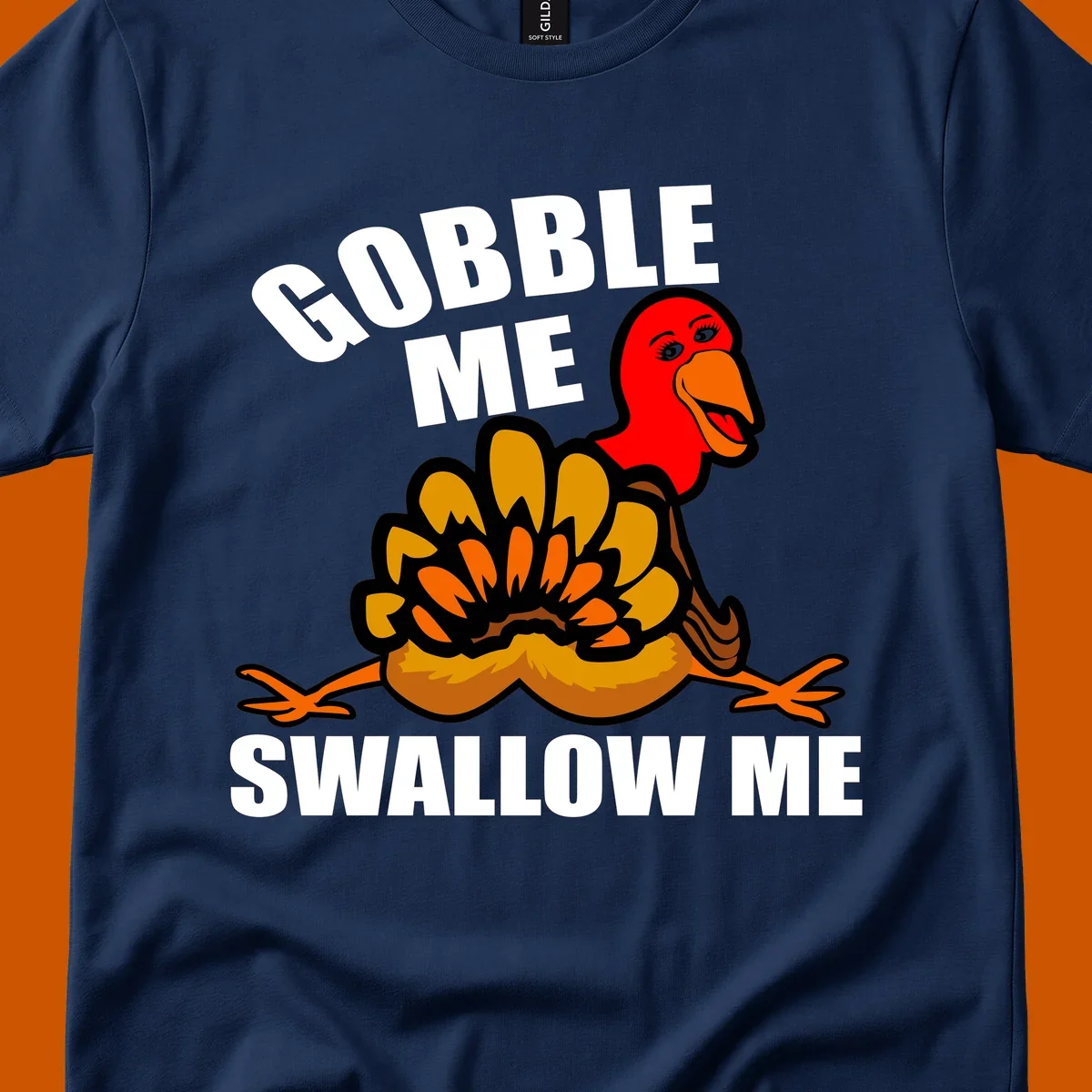 Funny Thanksgiving Gobble Me Swallow Me Turkey design with cartoon turkey and bold text.