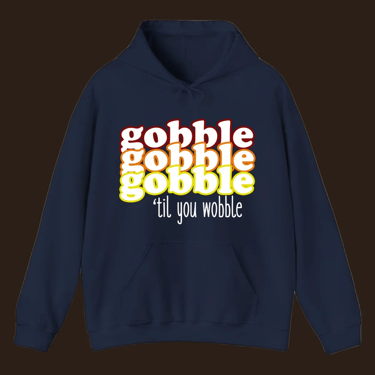 Gobble 'til you wobble thanksgiving text design with stacked gobble words in red, orange, yellow and white text below.