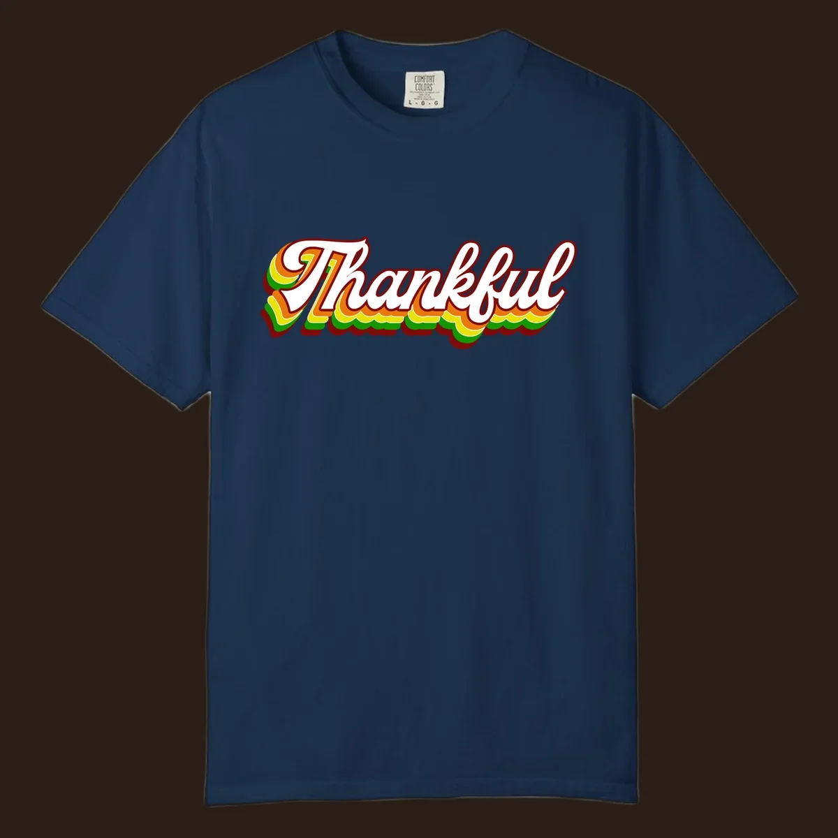 Retro thankful script text in white with colorful layered outlines and dark red shadow.