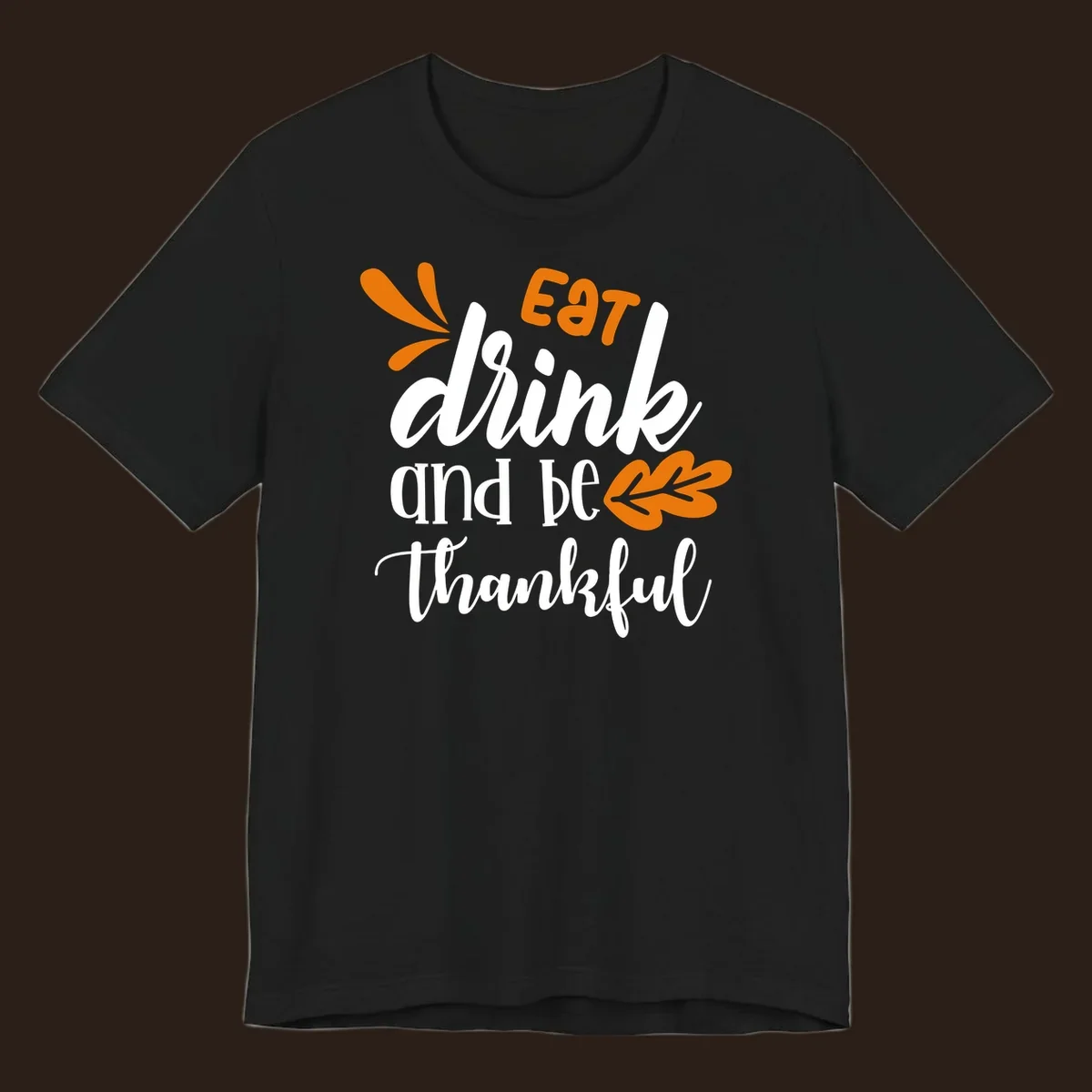 Eat Drink and Be Thankful Thanksgiving text and leaf graphic