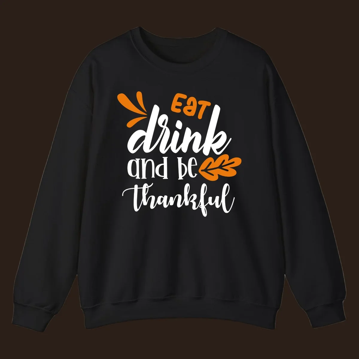 Eat Drink and Be Thankful Thanksgiving text and leaf graphic