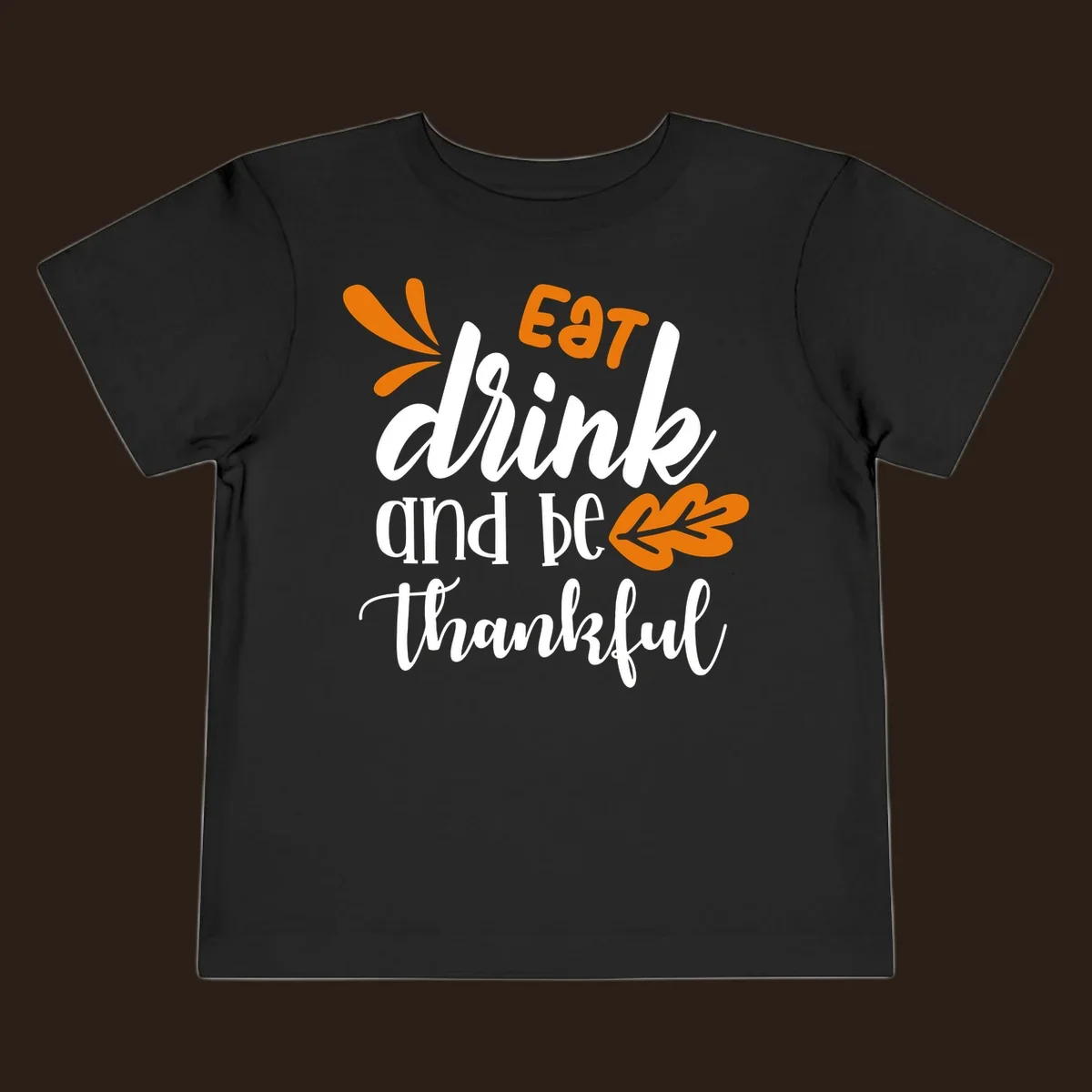 Eat Drink and Be Thankful Thanksgiving text and leaf graphic