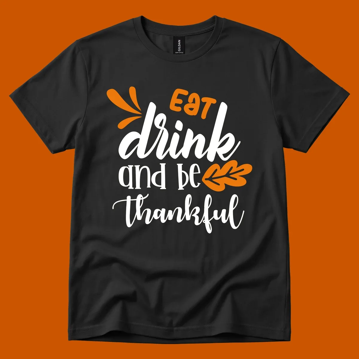 Eat Drink and Be Thankful Thanksgiving text and leaf graphic
