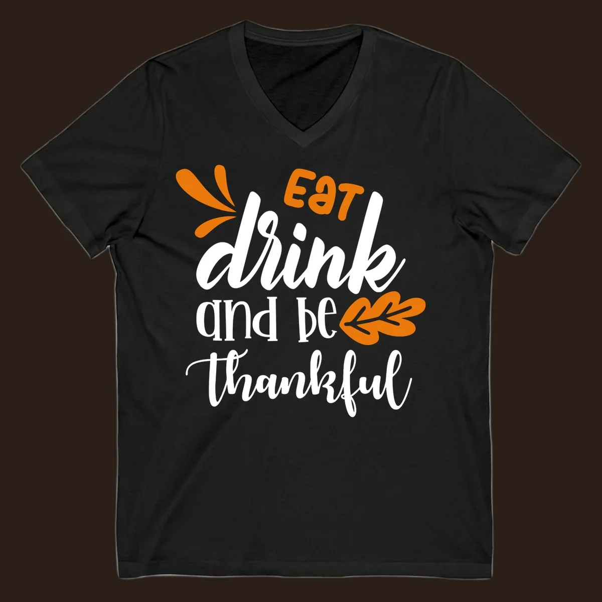 Eat Drink and Be Thankful Thanksgiving text and leaf graphic