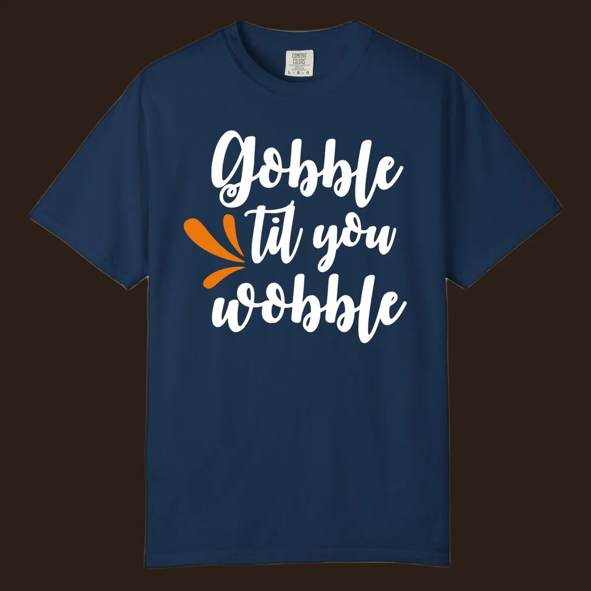 Gobble 'til you wobble Thanksgiving phrase with orange turkey feather illustrations.