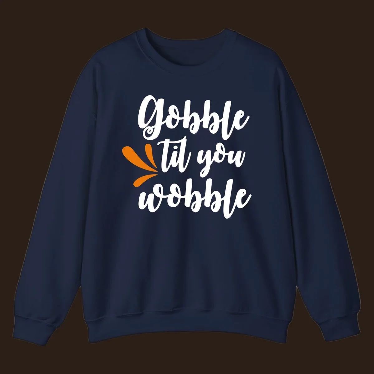 Gobble 'til you wobble Thanksgiving phrase with orange turkey feather illustrations.