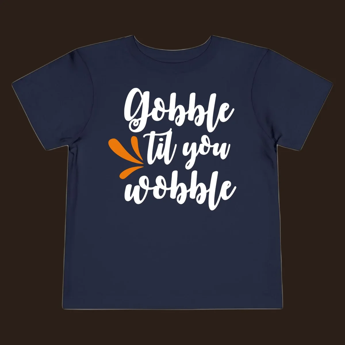 Gobble 'til you wobble Thanksgiving phrase with orange turkey feather illustrations.