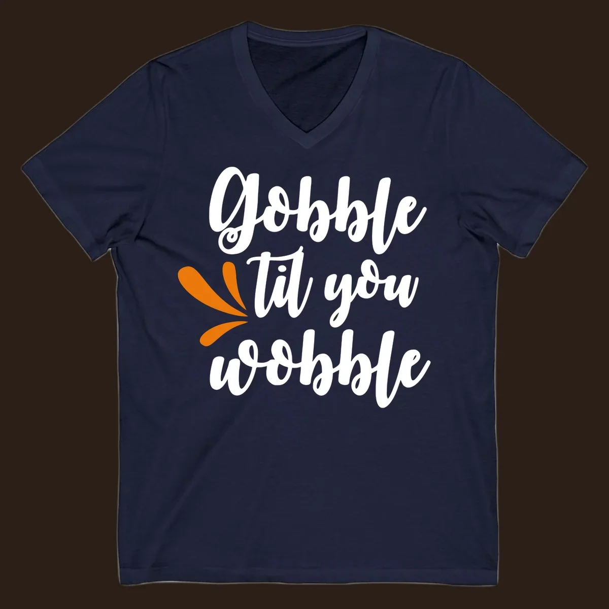 Gobble 'til you wobble Thanksgiving phrase with orange turkey feather illustrations.