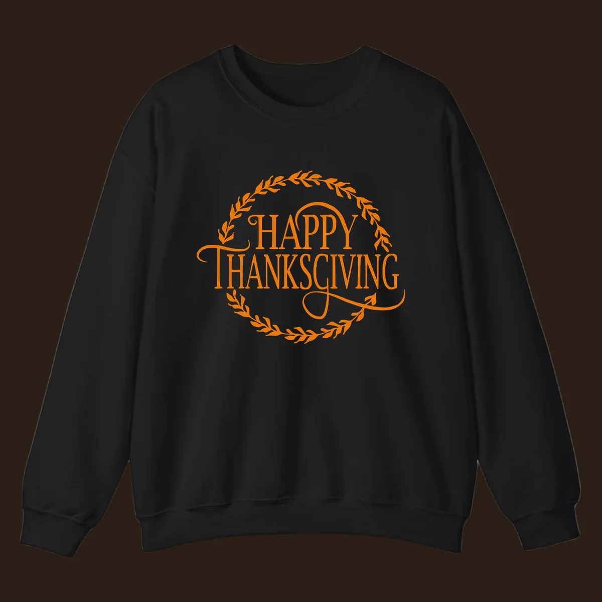 Happy Thanksgiving text with an orange leafy wreath.