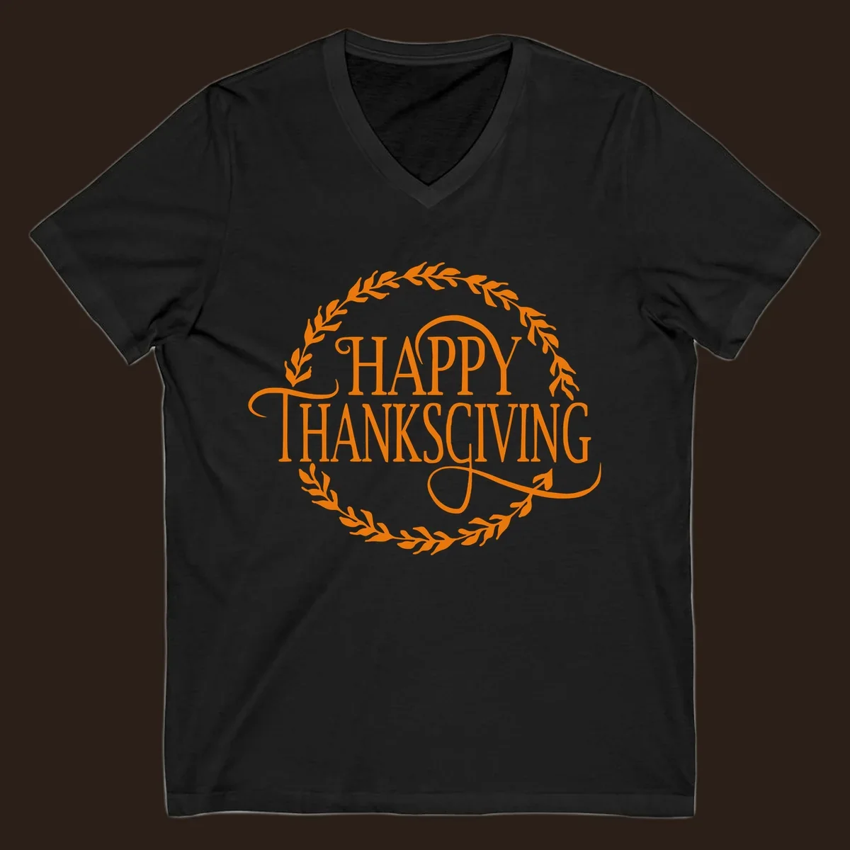 Happy Thanksgiving text with an orange leafy wreath.