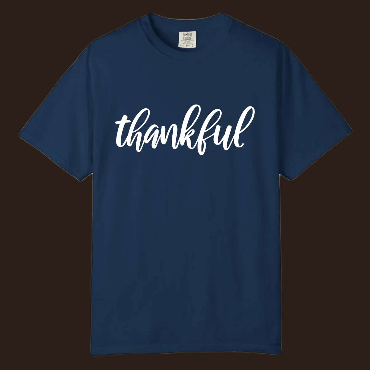White script text spelling 'thankful' on a black background, representing thankful script word art.