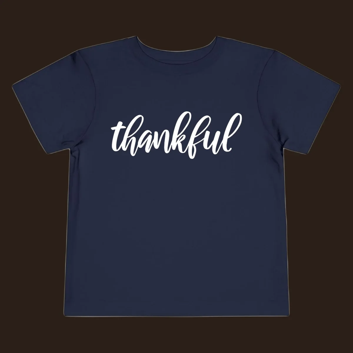 White script text spelling 'thankful' on a black background, representing thankful script word art.