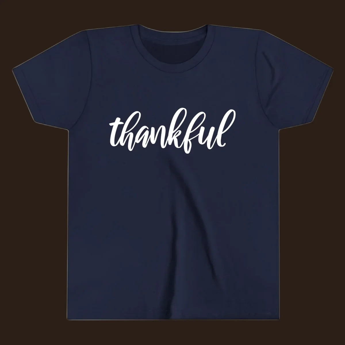 White script text spelling 'thankful' on a black background, representing thankful script word art.