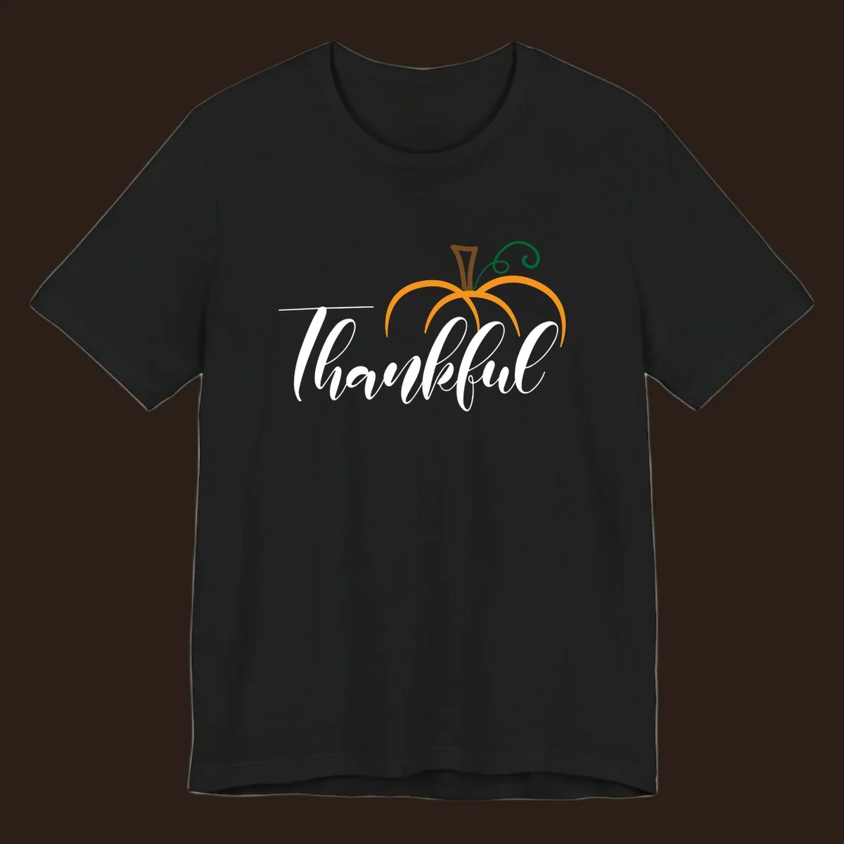 White script text 'Thankful' with a stylized orange pumpkin illustration.
