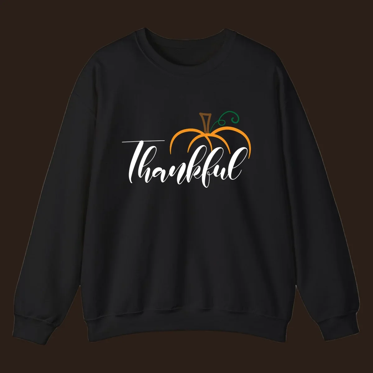 White script text 'Thankful' with a stylized orange pumpkin illustration.