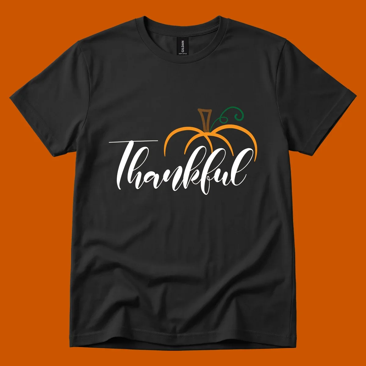 White script text 'Thankful' with a stylized orange pumpkin illustration.