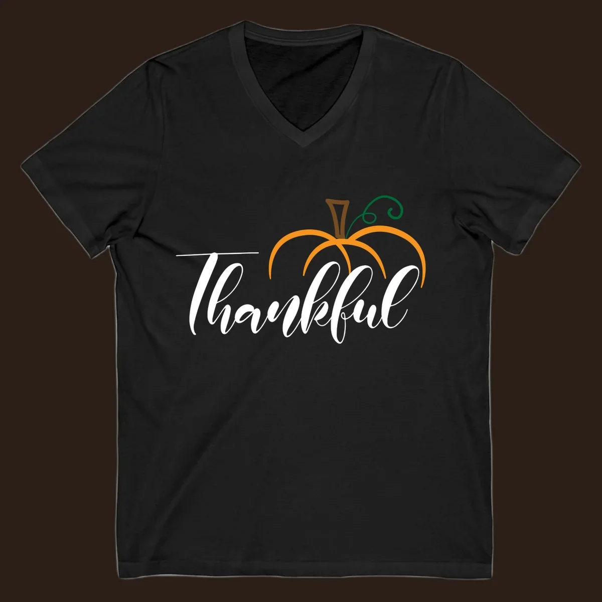 White script text 'Thankful' with a stylized orange pumpkin illustration.