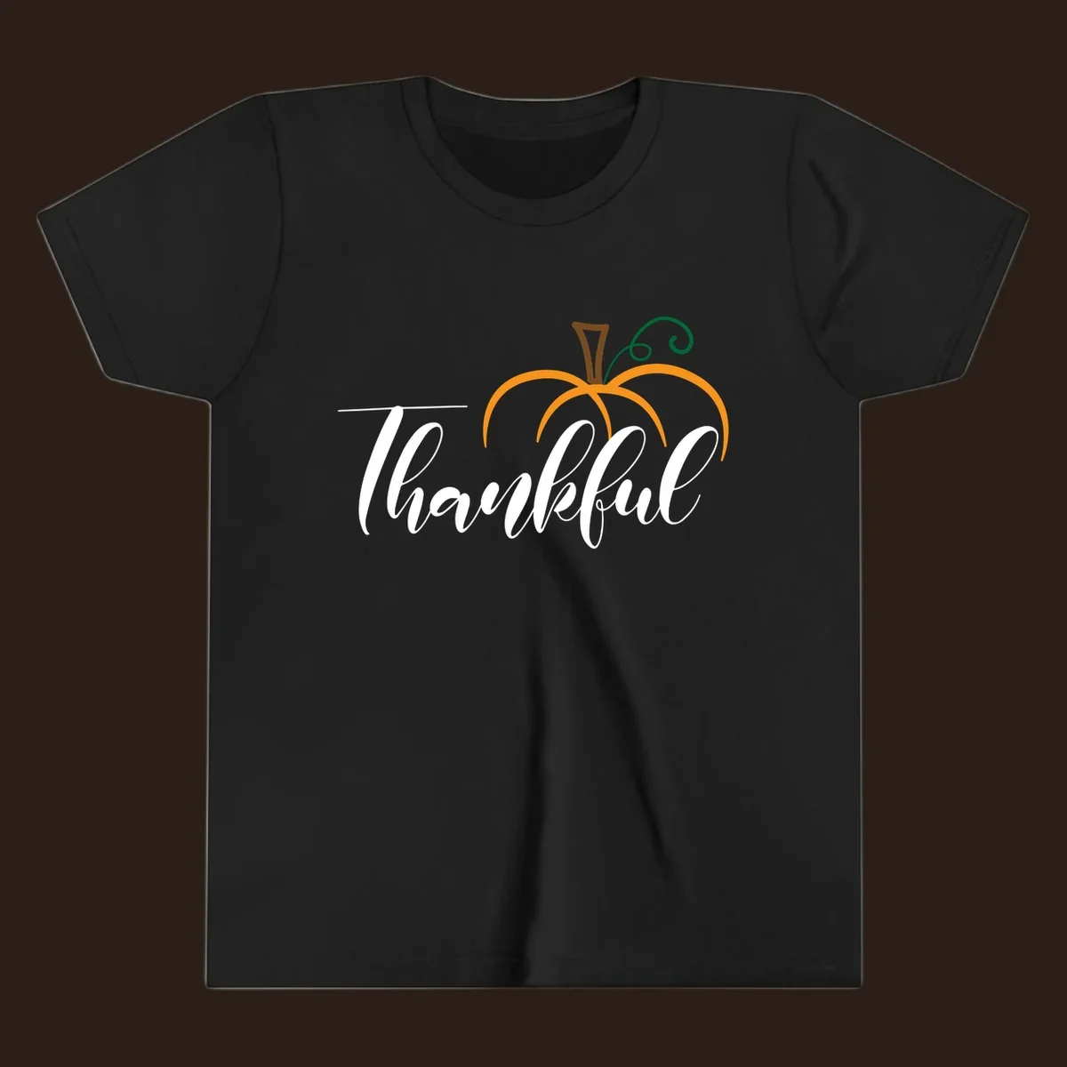 White script text 'Thankful' with a stylized orange pumpkin illustration.