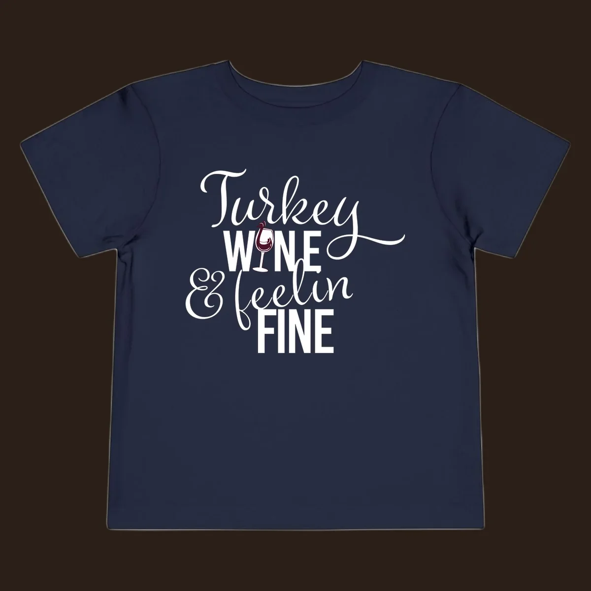 Turkey Wine Feelin Fine Thanksgiving design with text and wine glass illustration.