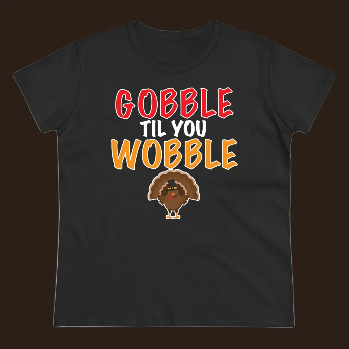 Gobble Til You Wobble text with a cartoon turkey wearing a pilgrim hat.