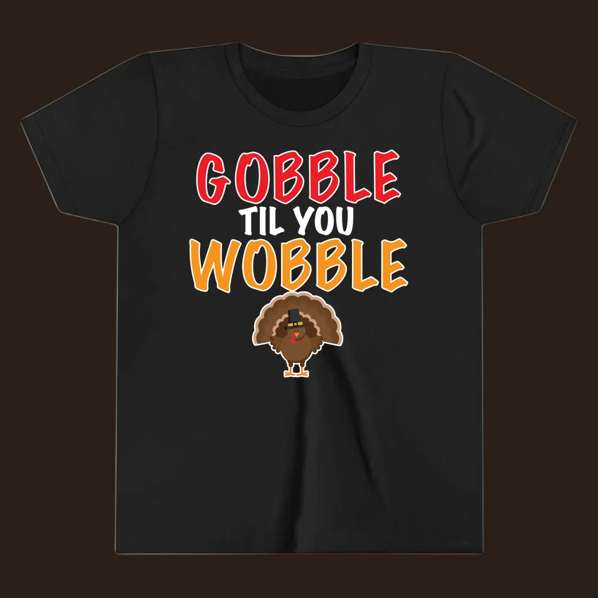 Gobble Til You Wobble text with a cartoon turkey wearing a pilgrim hat.