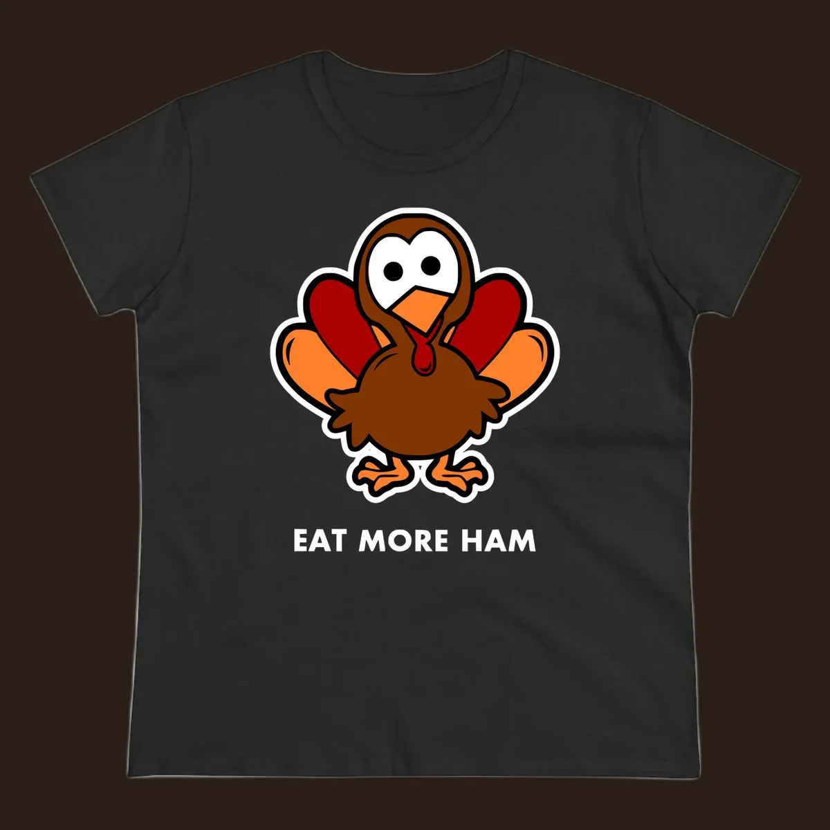 Cartoon turkey with 'Eat More Ham' text, promoting a fun Thanksgiving alternative.