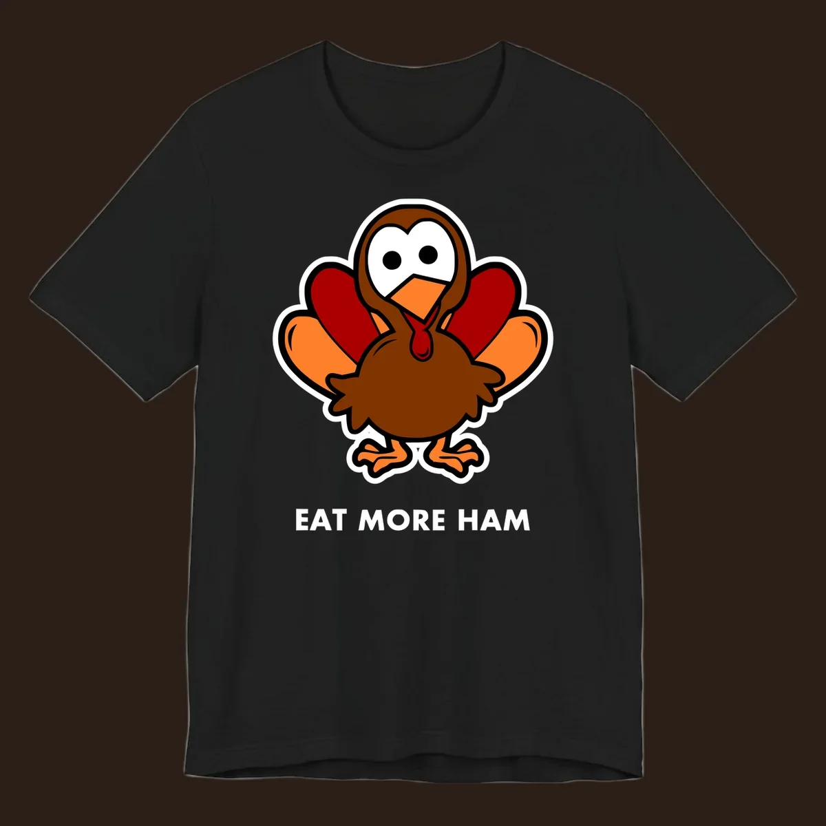 Cartoon turkey with 'Eat More Ham' text, promoting a fun Thanksgiving alternative.