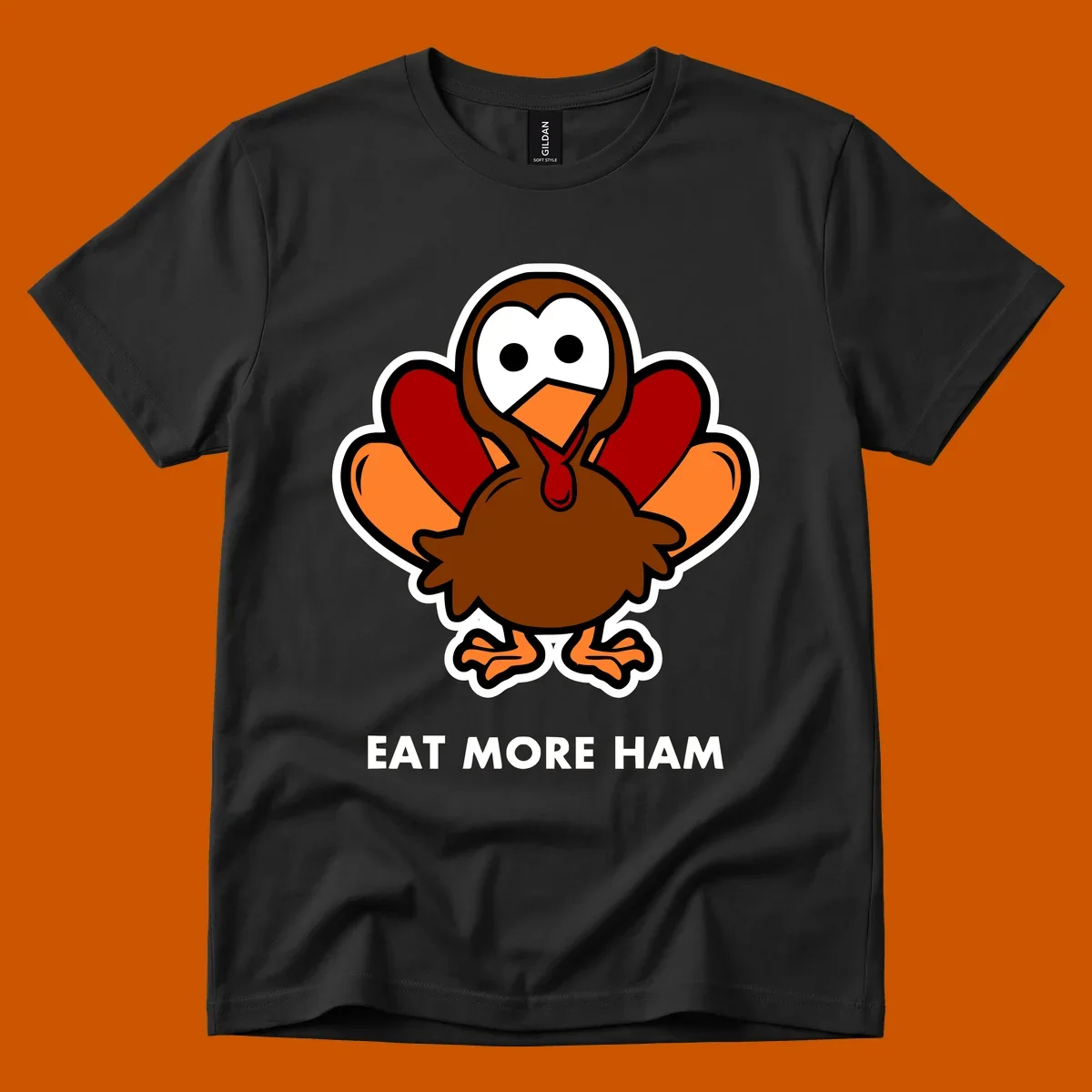 Cartoon turkey with 'Eat More Ham' text, promoting a fun Thanksgiving alternative.