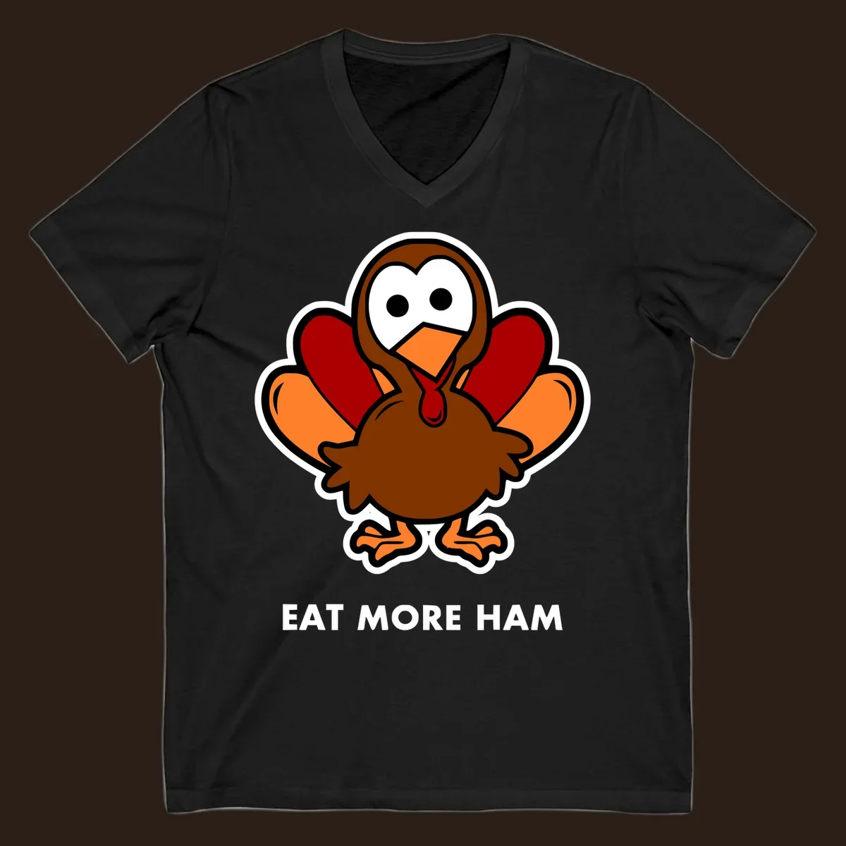 Cartoon turkey with 'Eat More Ham' text, promoting a fun Thanksgiving alternative.