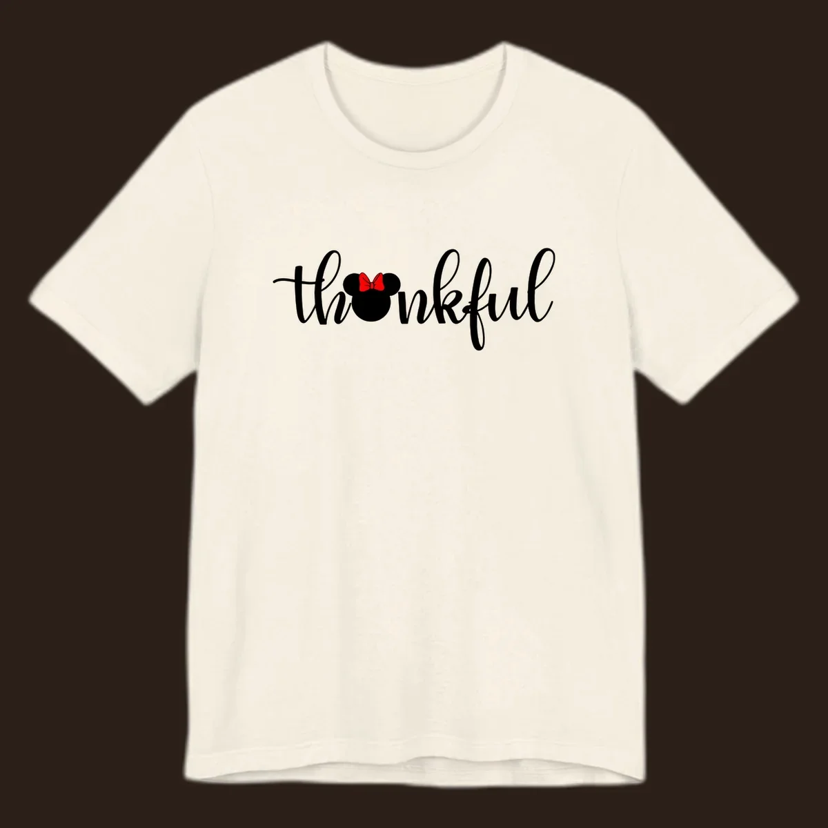 Minnie Mouse silhouette replaces the 'o' in the word 'thankful' in a script font.