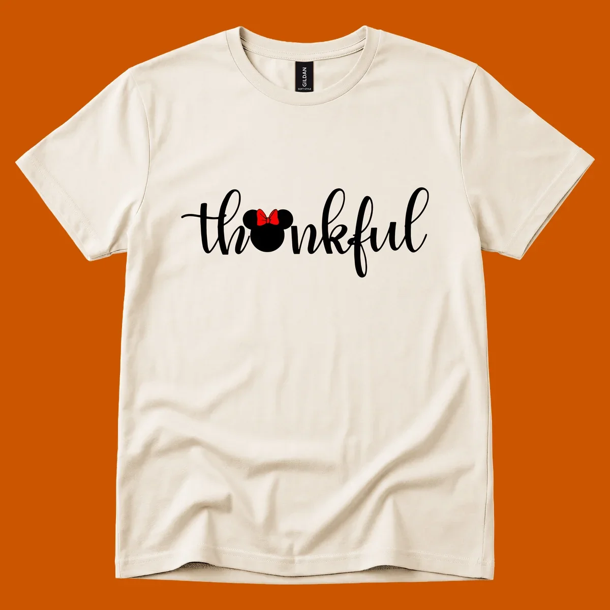 Minnie Mouse silhouette replaces the 'o' in the word 'thankful' in a script font.
