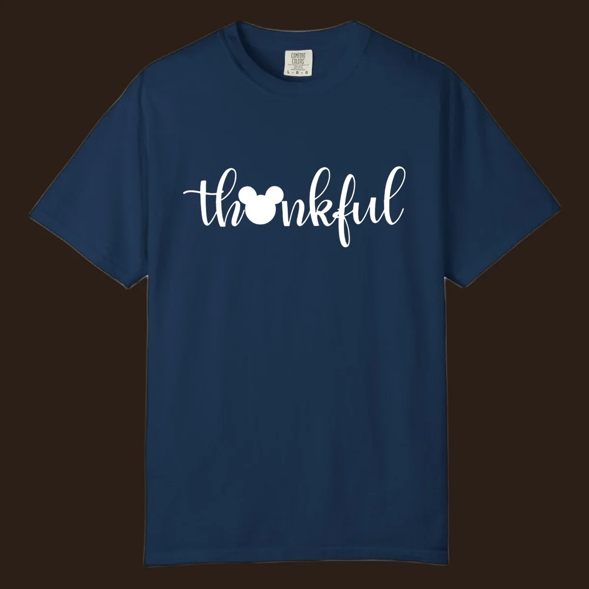 Script text 'thankful' with Mickey Mouse head silhouette replacing the 'o', in white and black variants.