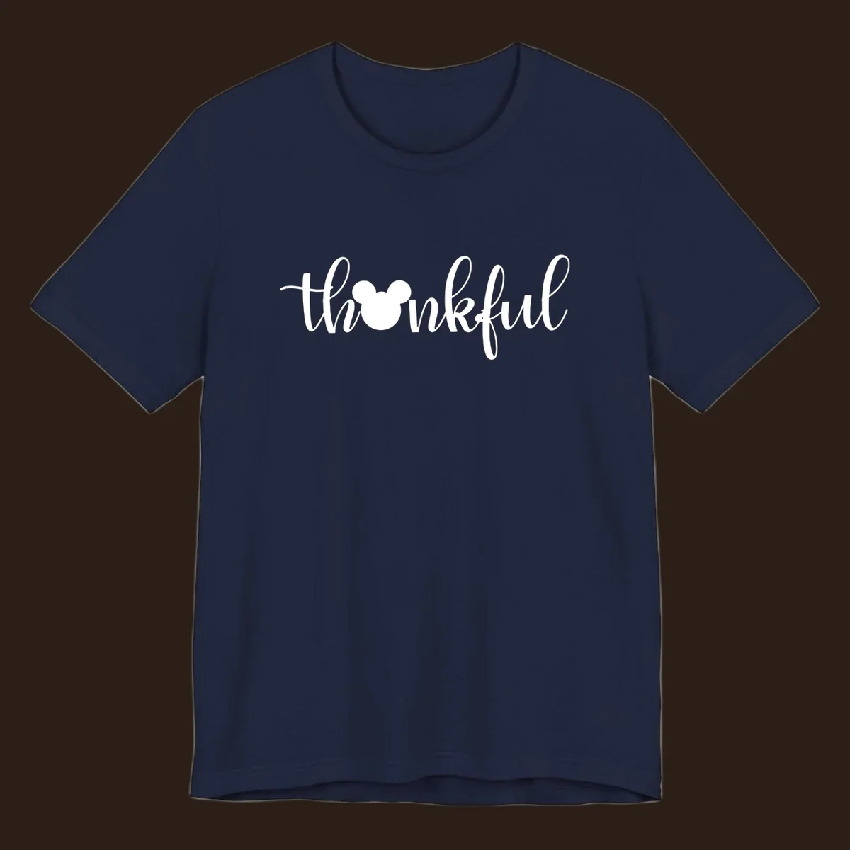 Script text 'thankful' with Mickey Mouse head silhouette replacing the 'o', in white and black variants.
