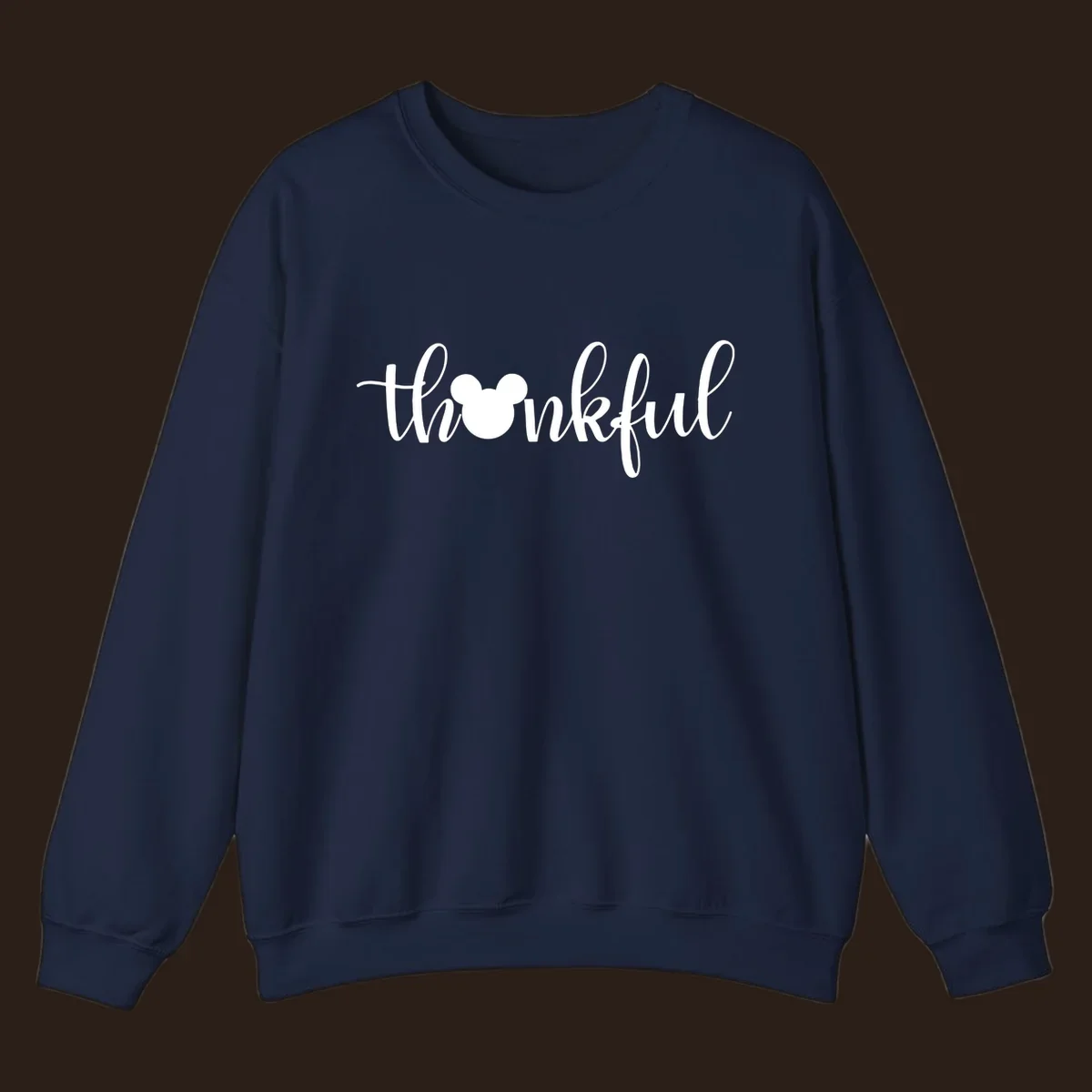 Script text 'thankful' with Mickey Mouse head silhouette replacing the 'o', in white and black variants.