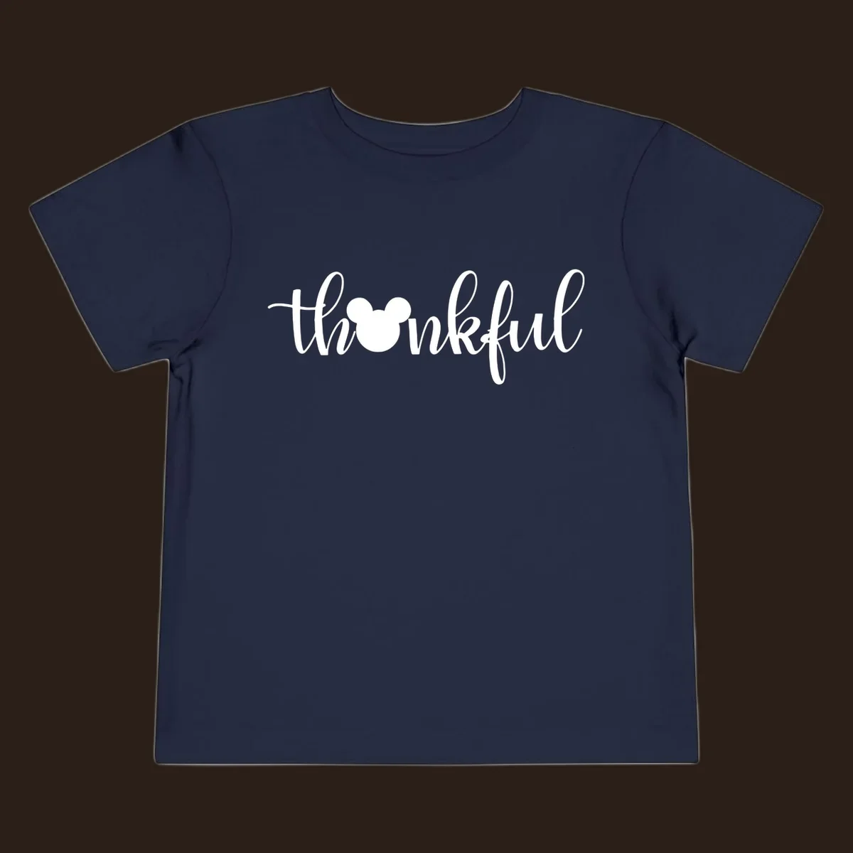 Script text 'thankful' with Mickey Mouse head silhouette replacing the 'o', in white and black variants.