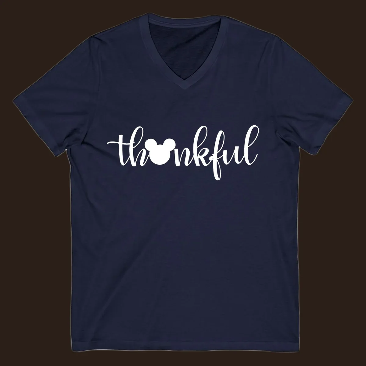 Script text 'thankful' with Mickey Mouse head silhouette replacing the 'o', in white and black variants.