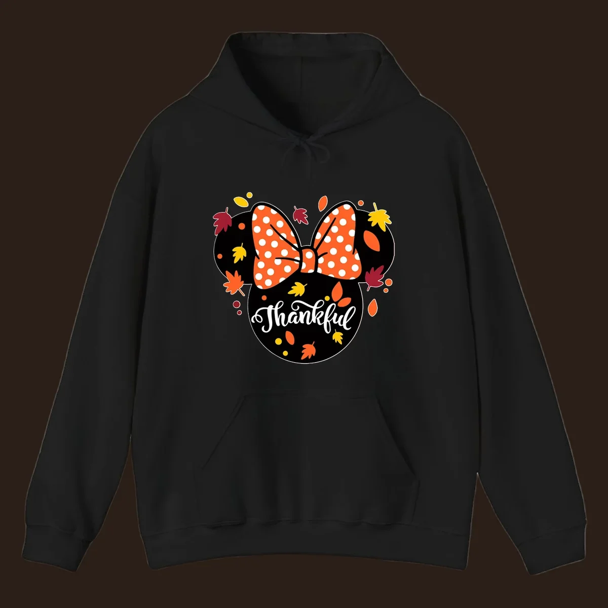 Minnie Mouse silhouette with polka dot bow and fall leaves, text reads Thankful.