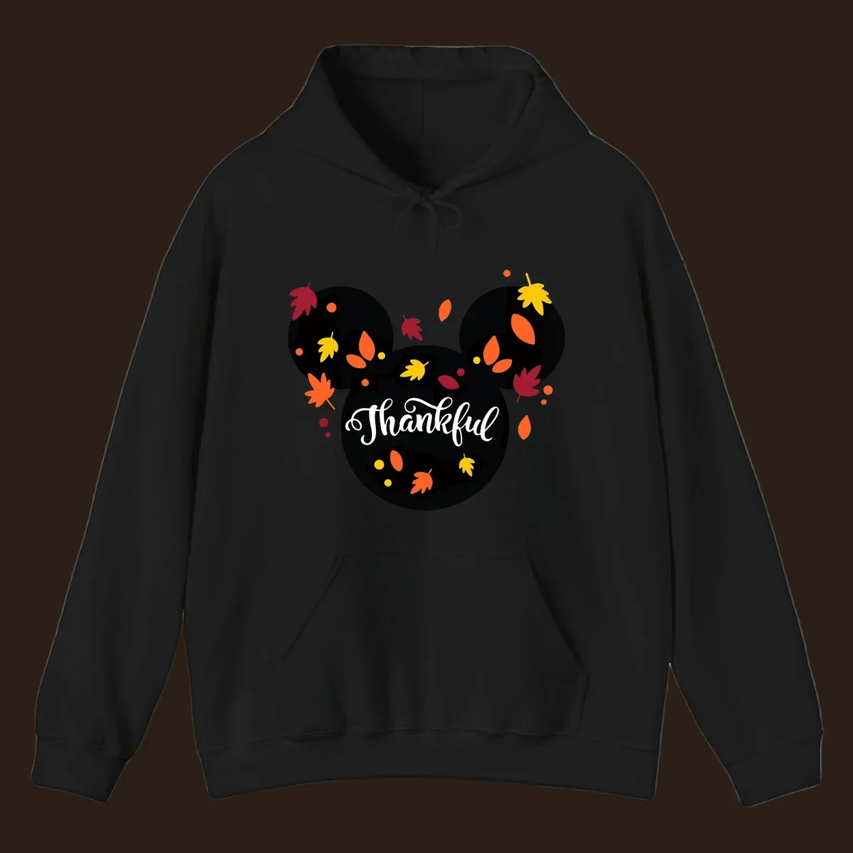 Mickey mouse head silhouette with 'Thankful' text and fall leaves, for thanksgiving shirts.