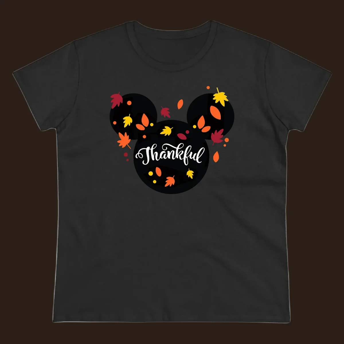 Mickey mouse head silhouette with 'Thankful' text and fall leaves, for thanksgiving shirts.