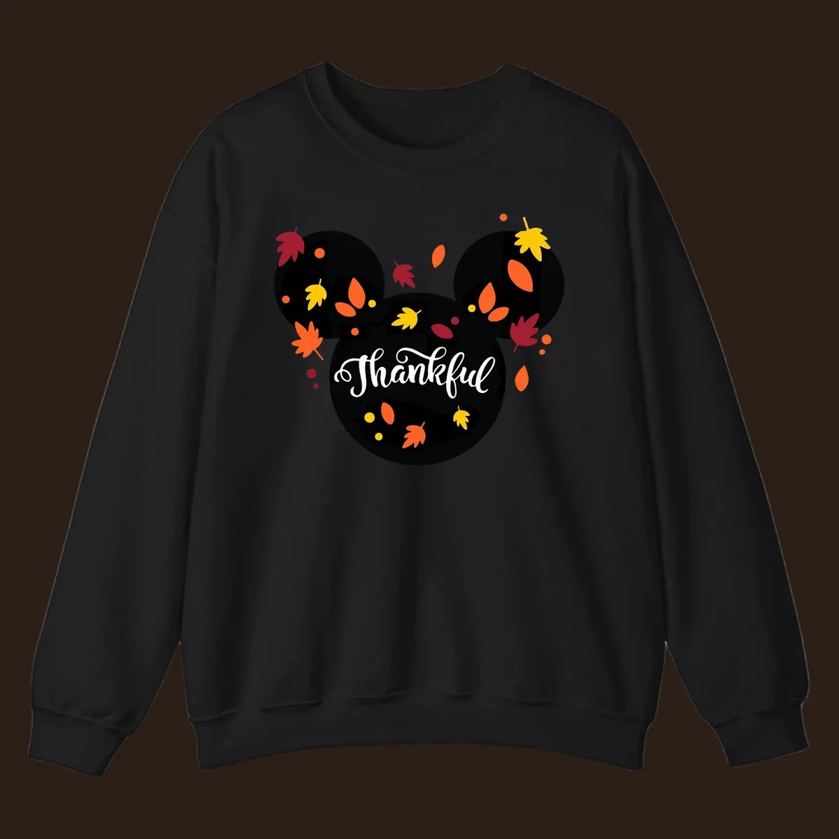 Mickey mouse head silhouette with 'Thankful' text and fall leaves, for thanksgiving shirts.