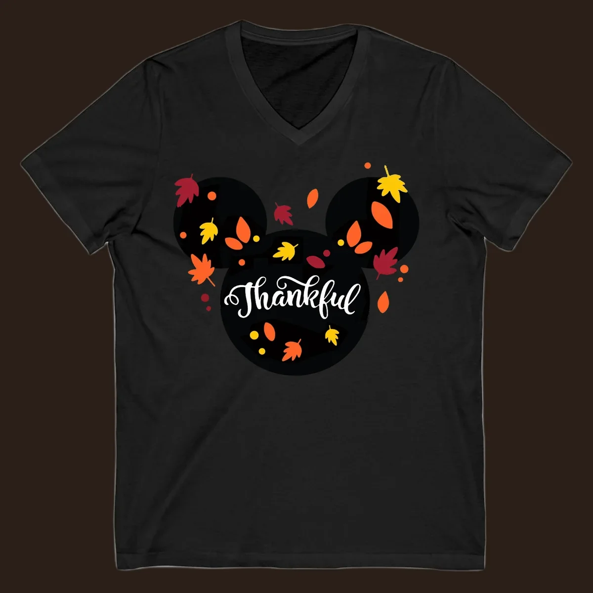 Mickey mouse head silhouette with 'Thankful' text and fall leaves, for thanksgiving shirts.