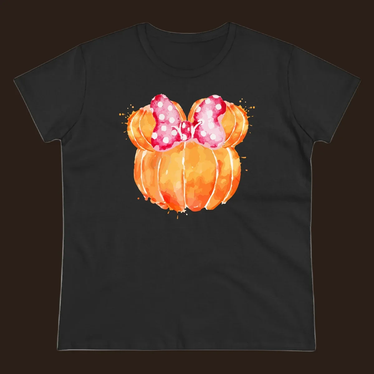 Watercolor illustration of two orange pumpkins shaped like Minnie Mouse ears with a pink polka dot bow.