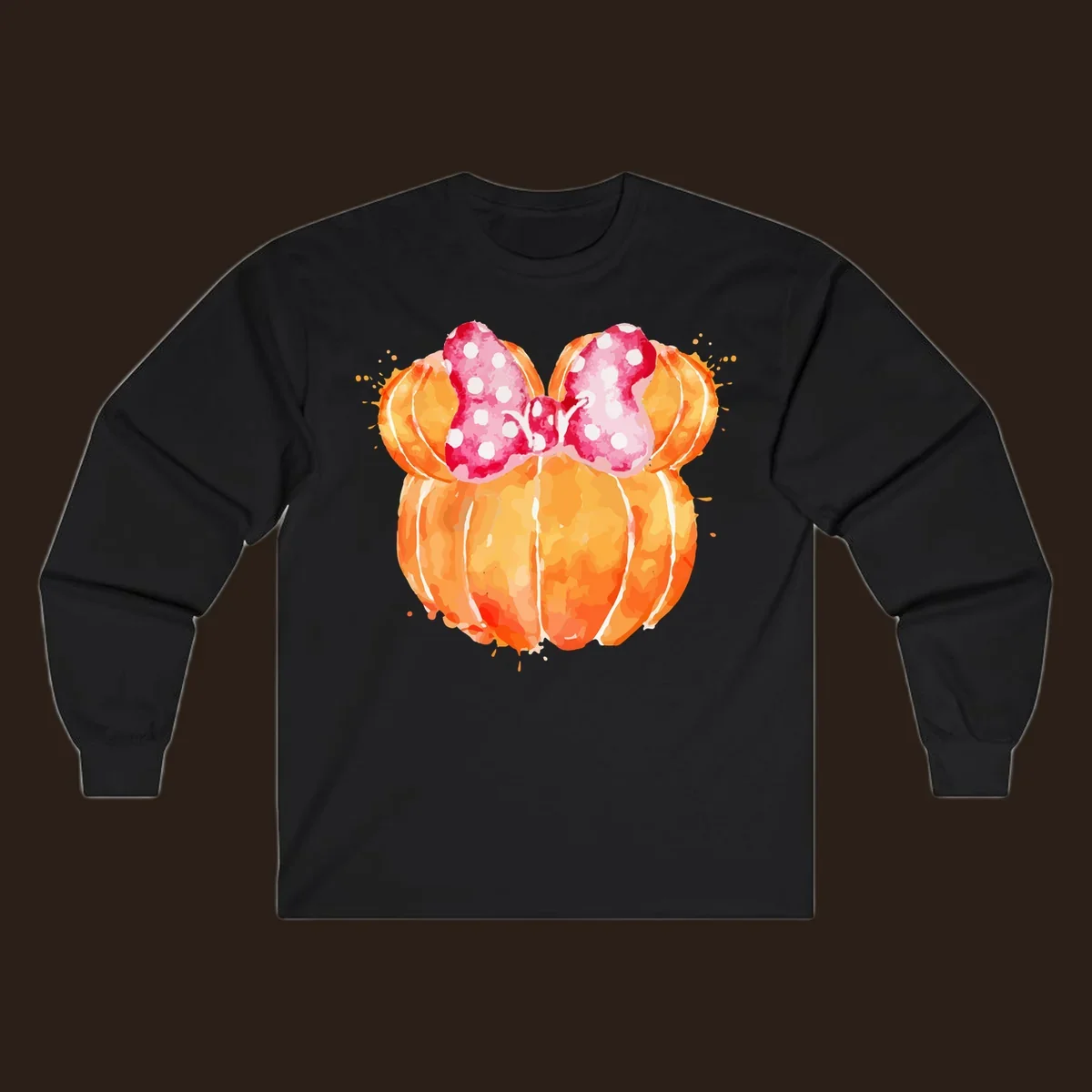 Watercolor illustration of two orange pumpkins shaped like Minnie Mouse ears with a pink polka dot bow.