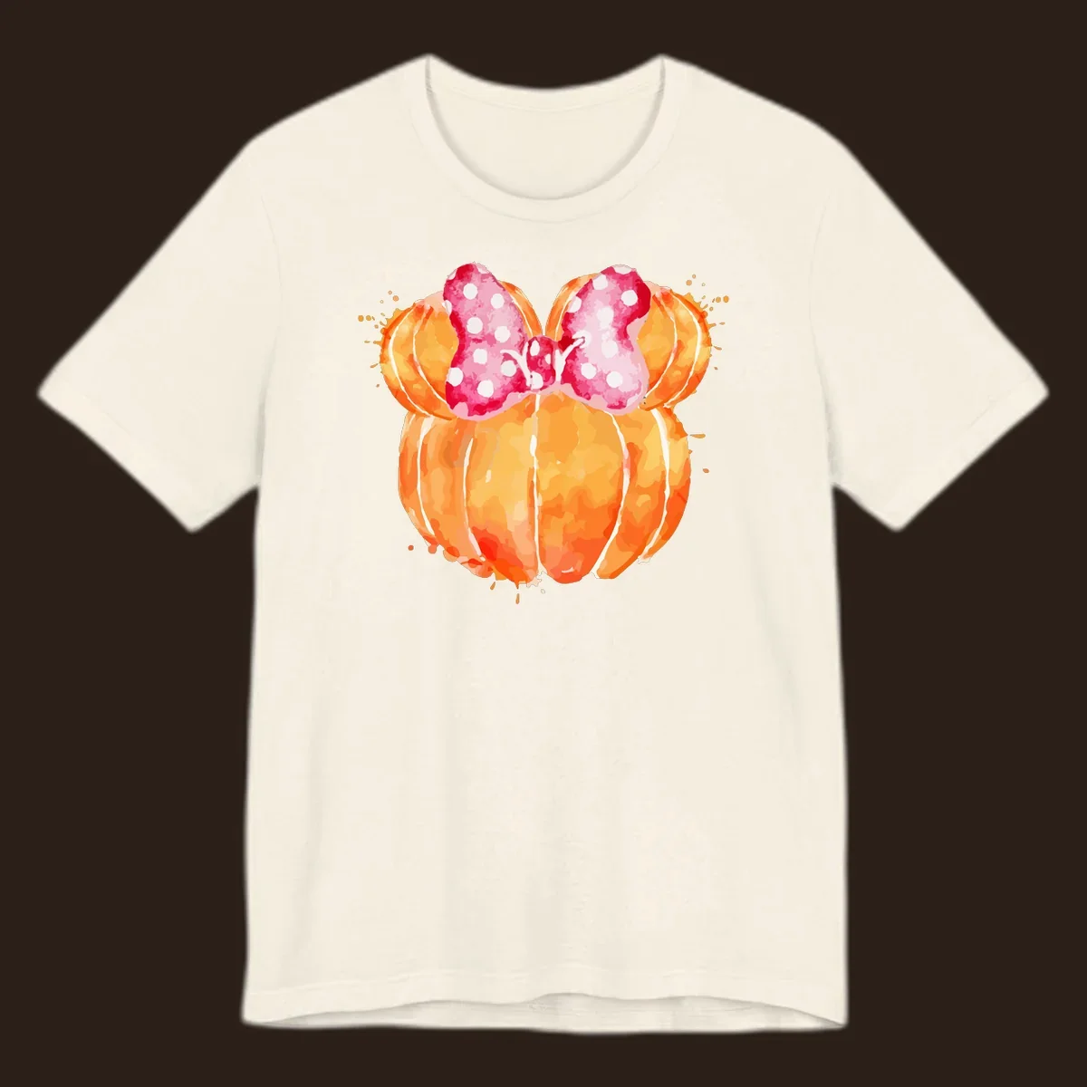Watercolor illustration of two orange pumpkins shaped like Minnie Mouse ears with a pink polka dot bow.