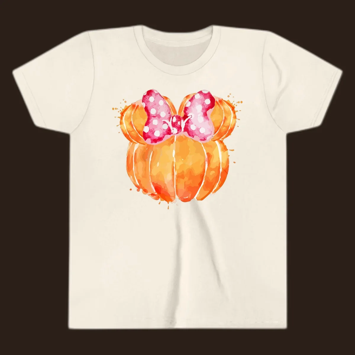Watercolor illustration of two orange pumpkins shaped like Minnie Mouse ears with a pink polka dot bow.