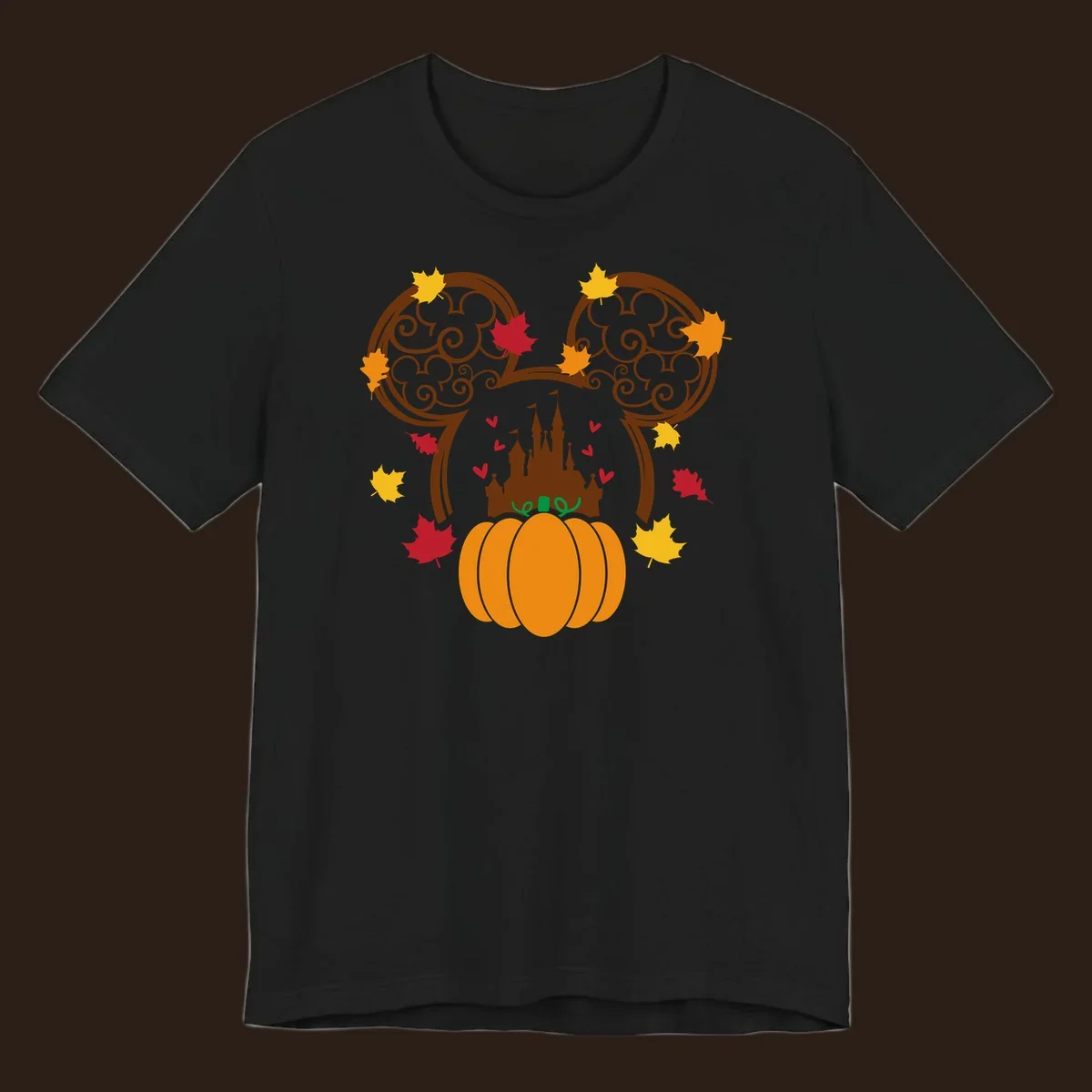 Disney fall pumpkin castle Mickey ears design with autumn leaves.