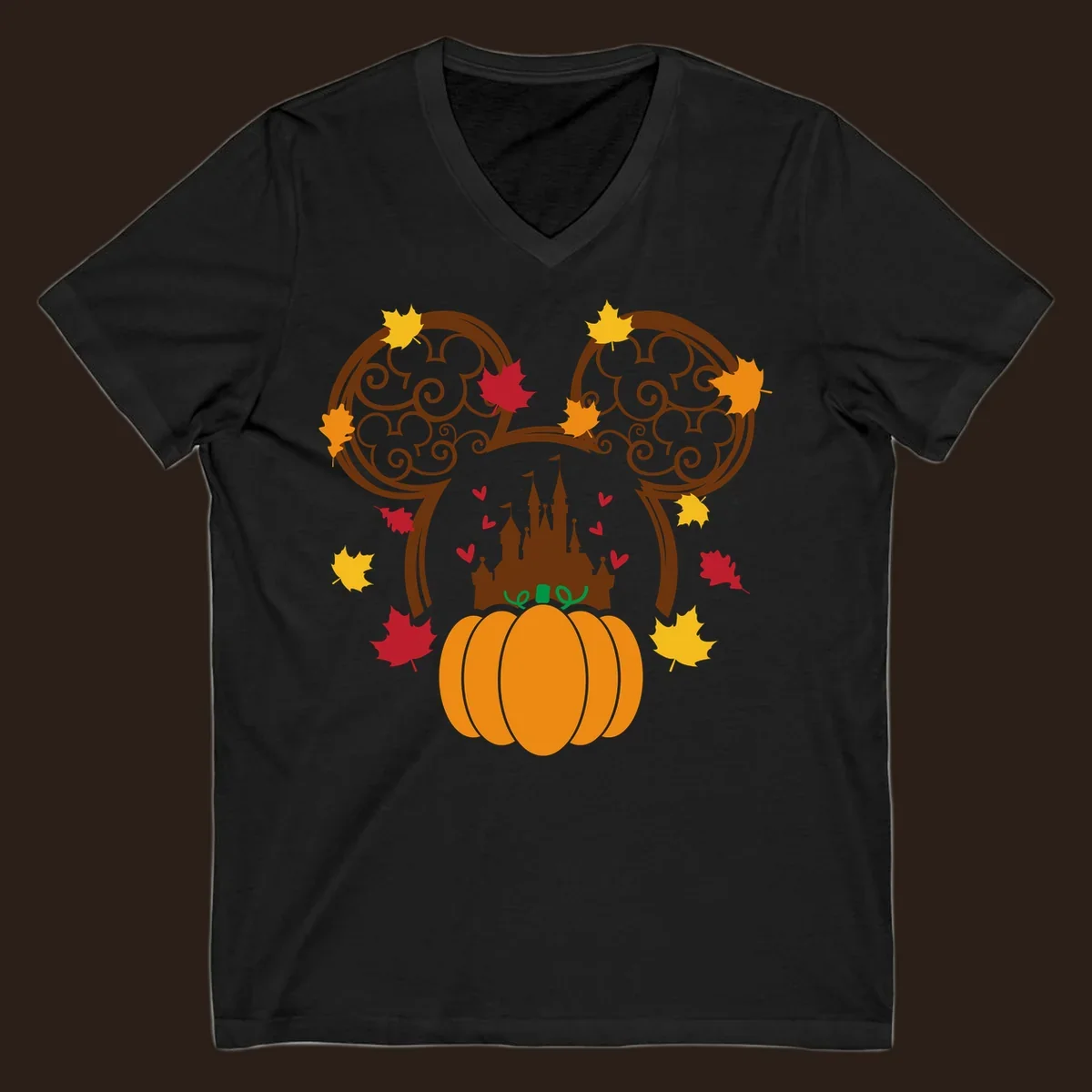 Disney fall pumpkin castle Mickey ears design with autumn leaves.