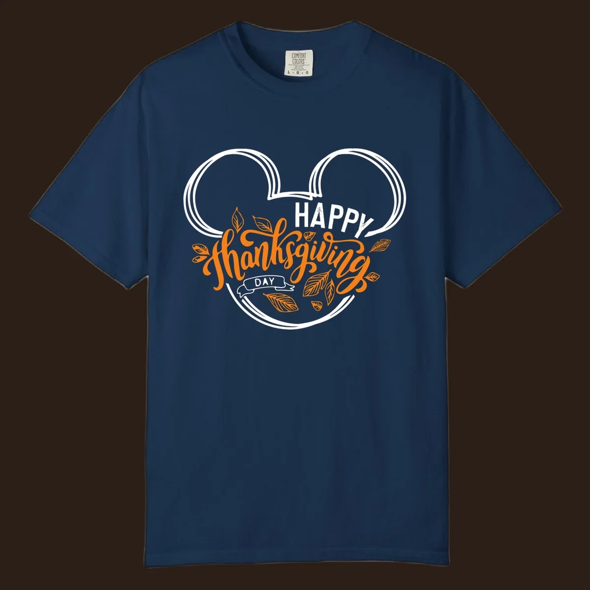 Happy Thanksgiving Day text with Mickey Mouse ears and fall leaves.