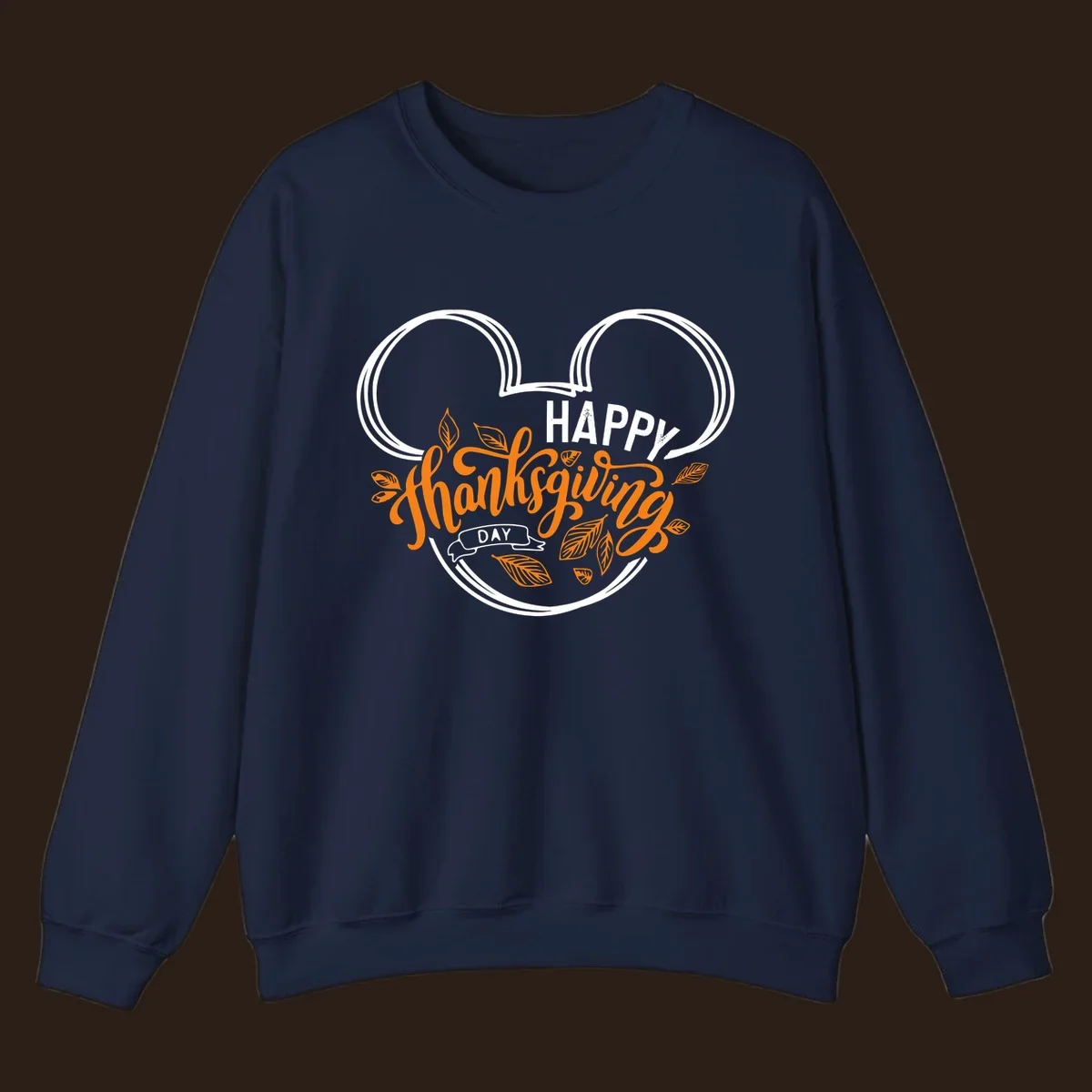 Happy Thanksgiving Day text with Mickey Mouse ears and fall leaves.